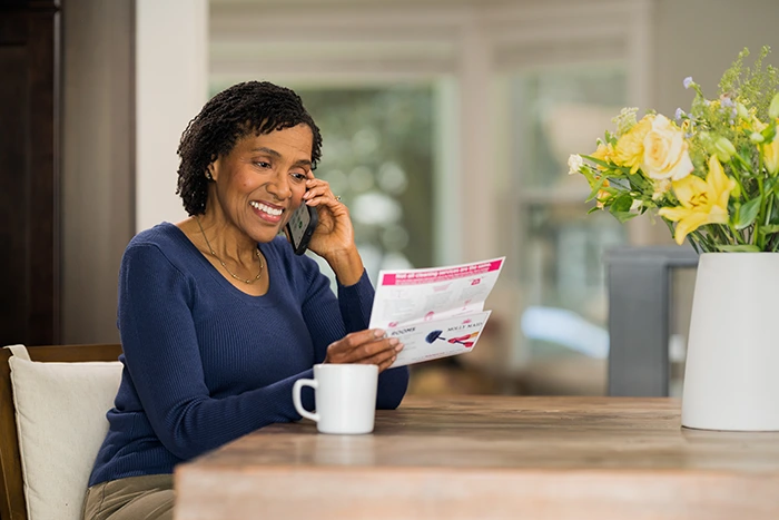 A Molly Maid professional discussing special event cleaning options with a customer over the phone.